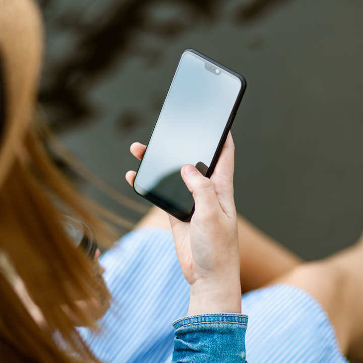 Person Holding Smartphone White Sitting